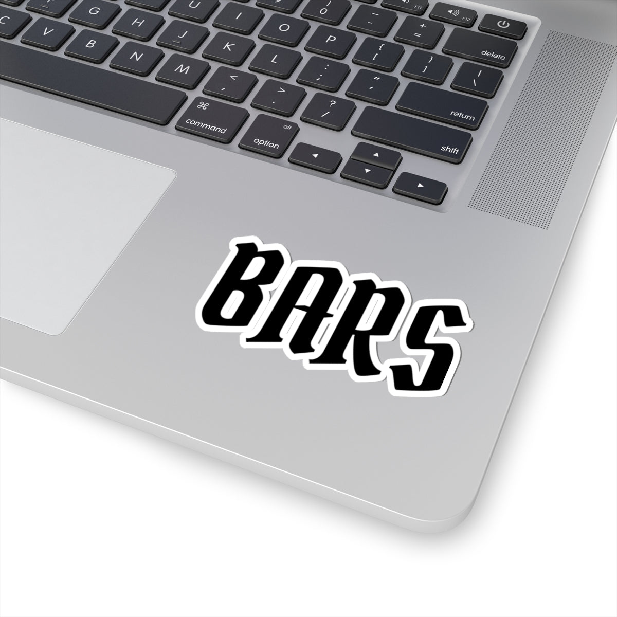 Laptop with a 'BARS' sticker on the palm rest area