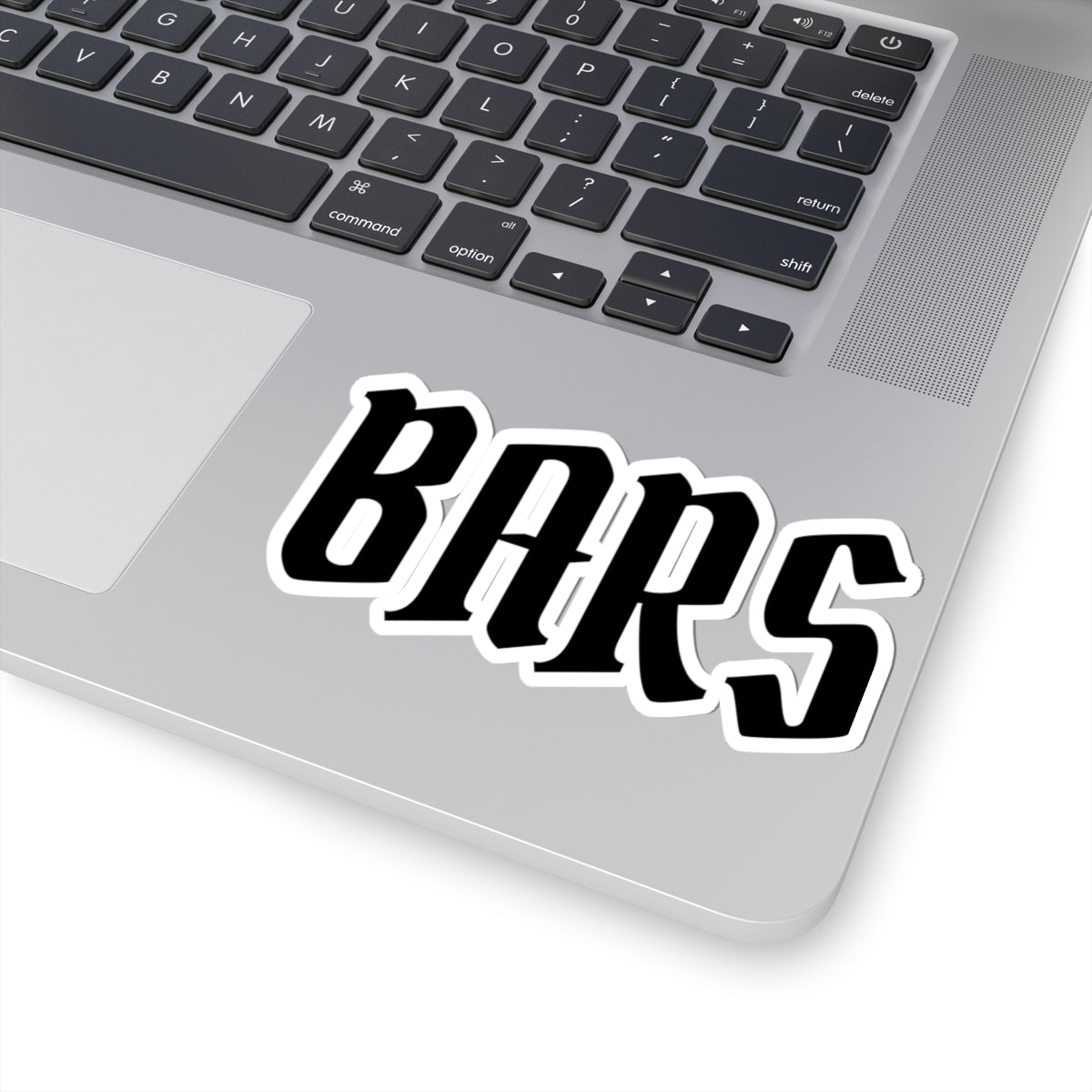 Laptop with a 'BARS' sticker on the palm rest area